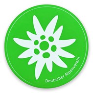 runder Aufkleber mit weißem Edelweiß und grünem Hintergrund